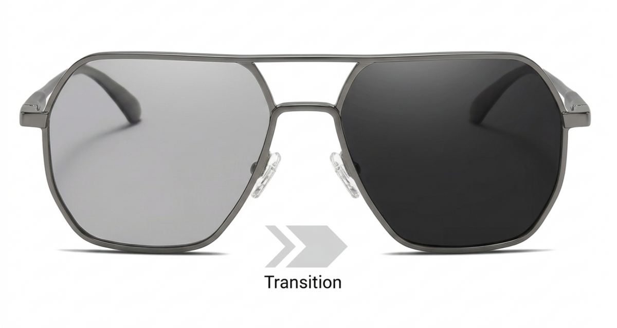 A pair of aviator-style photochromic UV TAC polarised sunglasses with a dark gray metal frame and two different lens colors shown side by side: a lighter silver-gray tinted lens on the left and a darker charcoal/black lens on the right, labeled 'Transition' below.