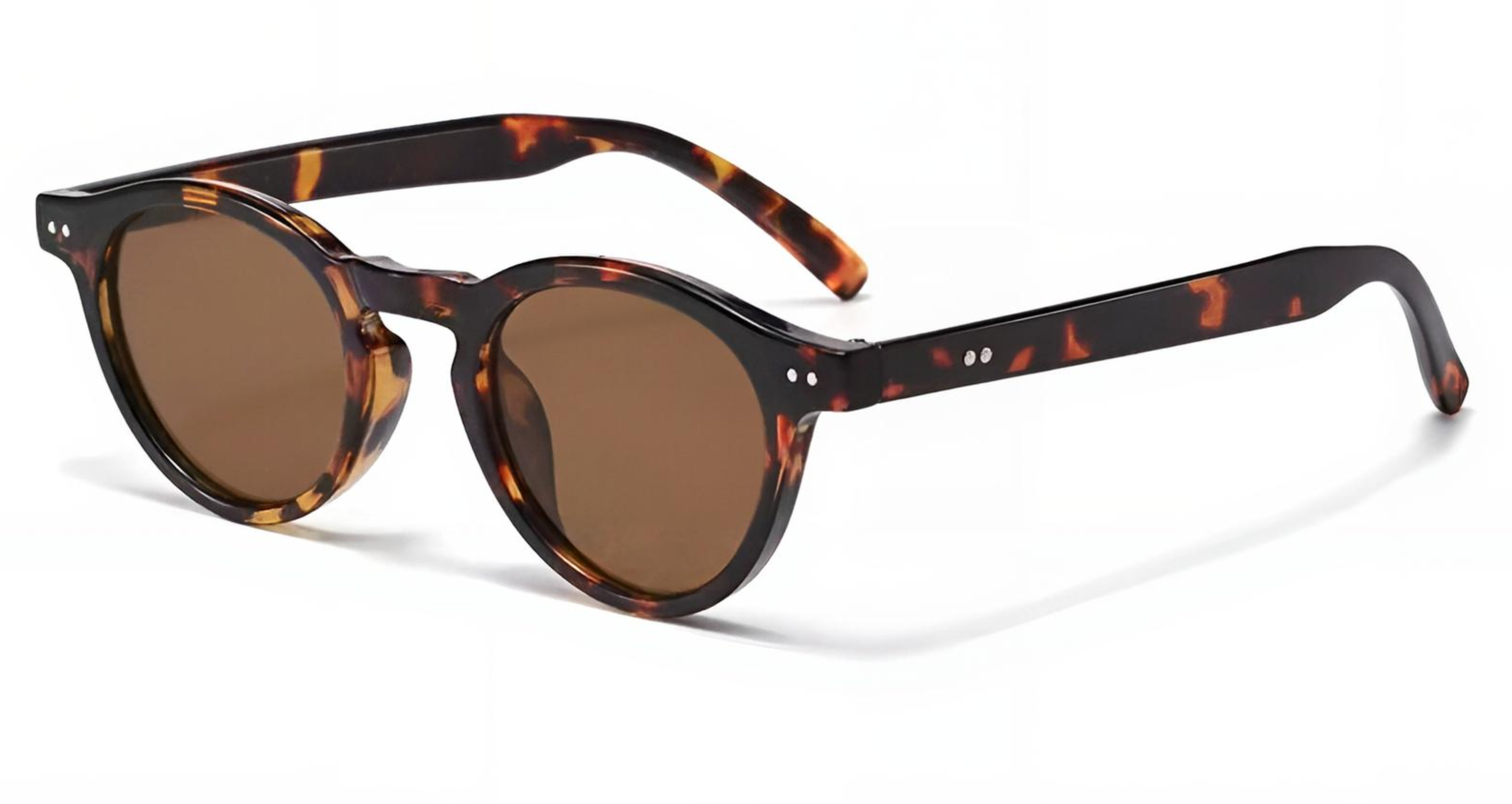 Sevilla - Round sunglasses with a dark brown and amber tortoiseshell acetate frame and matching brown lenses, shown on a clean white background - Missandtrendy