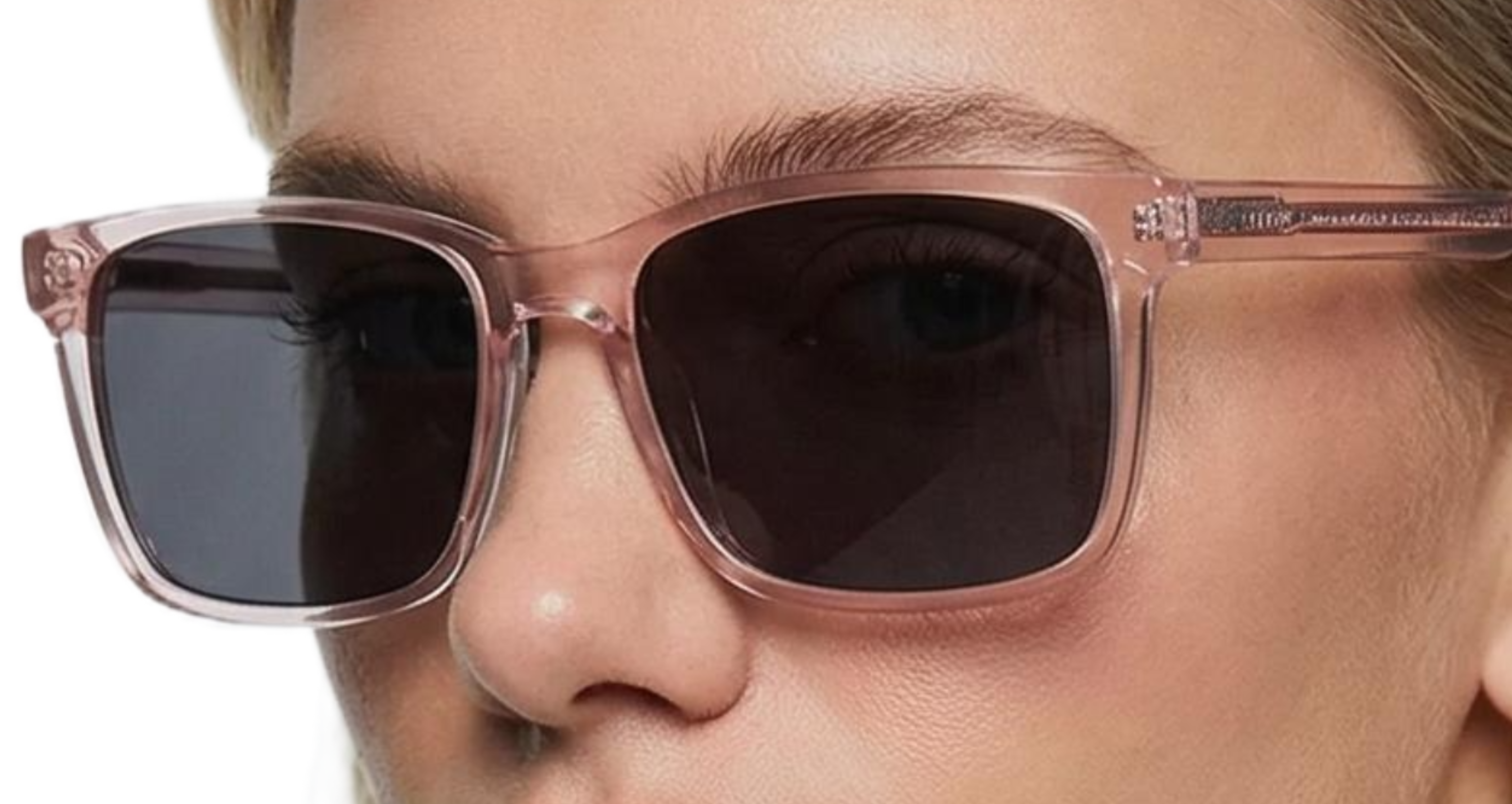 Woman wearing Missandtrendy waves polarised sunglasses with clear pink frame and black lens 45º side view_main