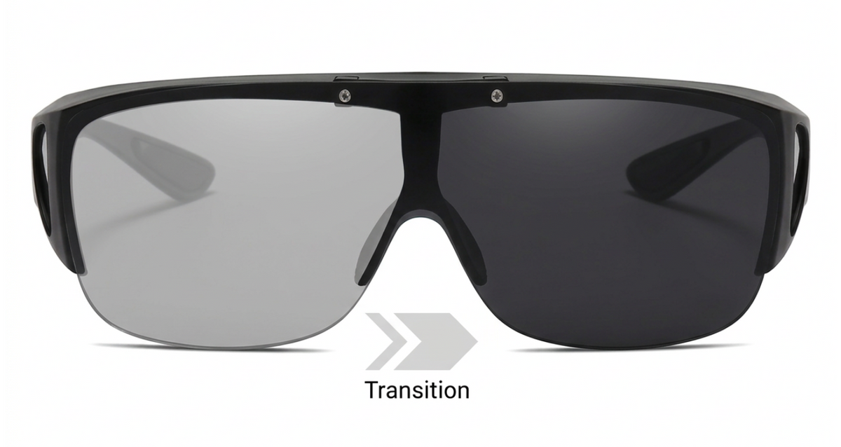 Black shield-style photochromic  UV TAC polarised sunglasses with a large wraparound lens, shown on a white background. The left lens is light gray and the right lens is dark gray, with the word 'Transition' and arrow graphic below to indicate a transition lens product.