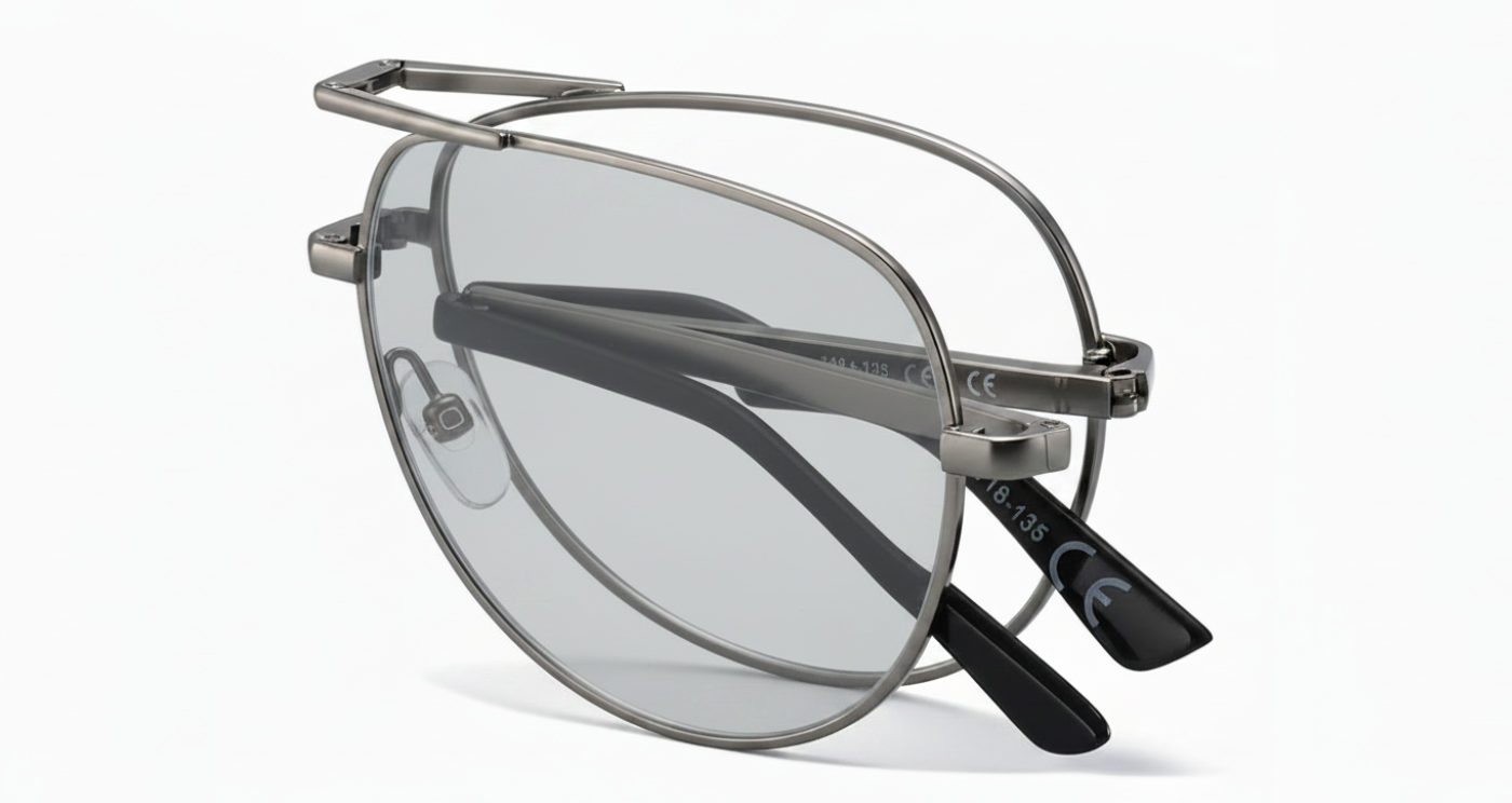 A pair of modern c folding aviator-style eyeglasses with a thin silver-tone metal frame, photochromic lenses, and black temple tips, shown on a clean white background by Missandtrendy
